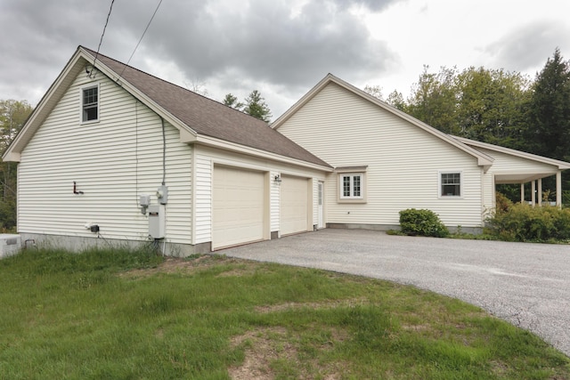 359 Beech Plains Rd, Buxton, ME 04093 - view of home's exterior featuring asphalt driveway, an attached garage, and a shingled roof
