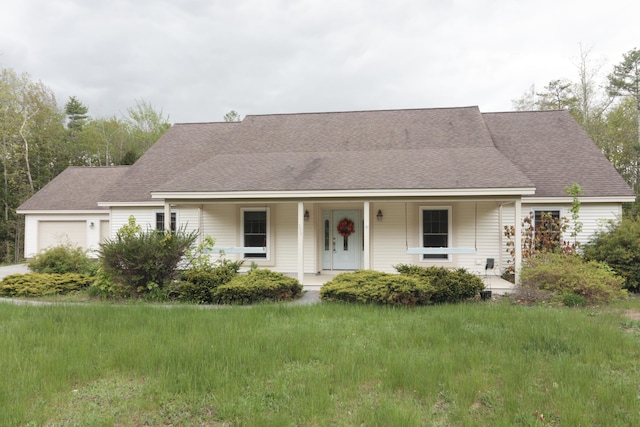 359 Beech Plains Rd, Buxton, ME 04093 - view of front of home with an attached garage, a porch, a front lawn, and a shingled roof