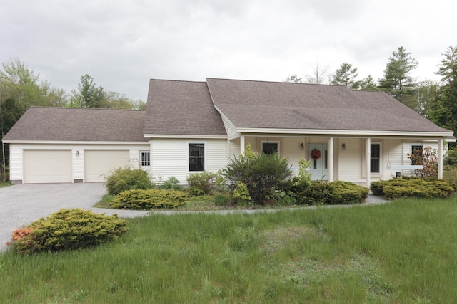 359 Beech Plains Rd, Buxton, ME 04093 - view of front facade featuring a garage, asphalt driveway, covered porch, and roof with shingles
