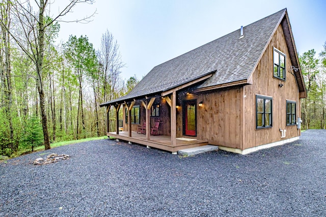 view of front of house with roof with shingles