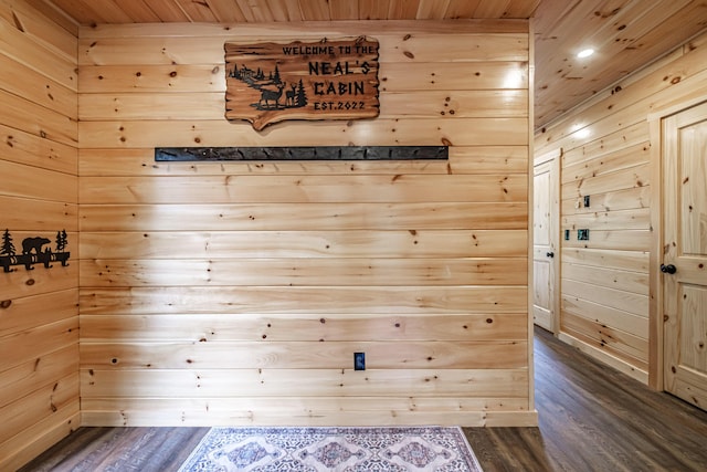 detailed view of wood finished floors, wood ceiling, wood walls, and recessed lighting