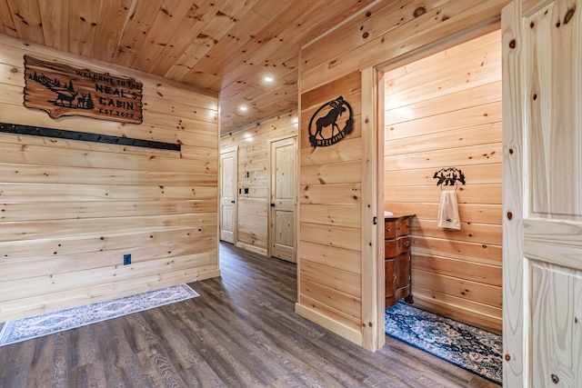 unfurnished room featuring dark wood-type flooring, recessed lighting, wooden walls, and wooden ceiling