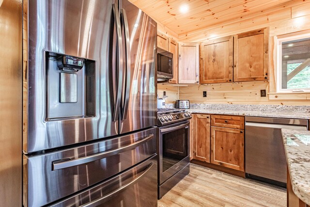 kitchen featuring stainless steel appliances, light wood-type flooring, light stone countertops, wood ceiling, and brown cabinets