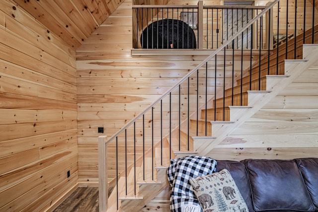 staircase with wooden walls