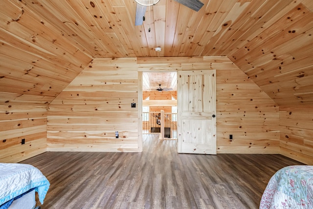 bedroom featuring wooden ceiling, wood walls, lofted ceiling, and wood finished floors