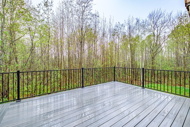 deck featuring a forest view