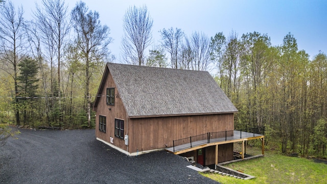view of outdoor structure with a forest view