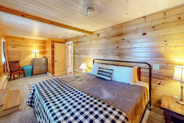 352 Georges Pond Rd, Franklin, ME 04634 - bedroom with wood finished floors, wooden walls, beam ceiling, and wood ceiling