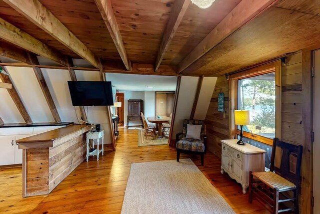 352 Georges Pond Rd, Franklin, ME 04634 - living area with light wood-style floors and beam ceiling