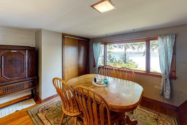 352 Georges Pond Rd, Franklin, ME 04634 - dining space featuring wood finished floors and baseboards