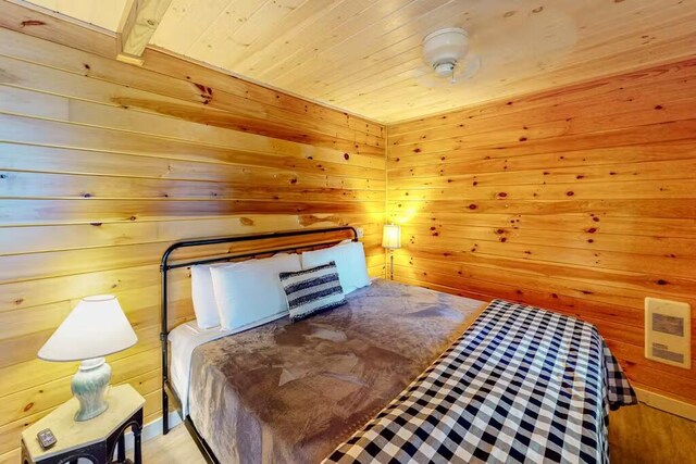 352 Georges Pond Rd, Franklin, ME 04634 - bedroom featuring wood walls and wooden ceiling