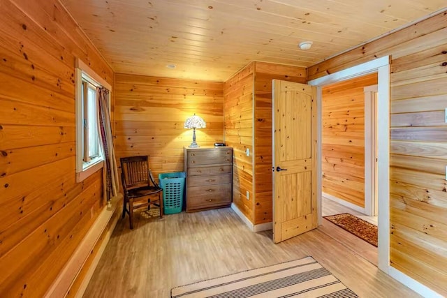 352 Georges Pond Rd, Franklin, ME 04634 - sitting room with light wood-type flooring, wood ceiling, and wood walls