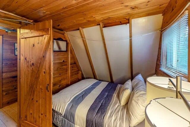 352 Georges Pond Rd, Franklin, ME 04634 - bedroom featuring lofted ceiling, wood ceiling, and wooden walls