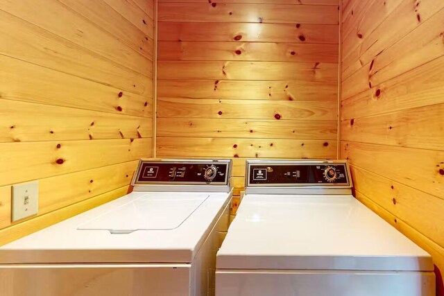 352 Georges Pond Rd, Franklin, ME 04634 - laundry area with washing machine and dryer and wooden walls