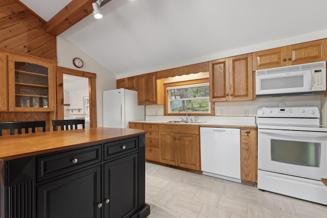 62 Lady Slipper Ln, Weld, ME 04285 - kitchen with white appliances, a sink, vaulted ceiling, light countertops, and dark cabinetry