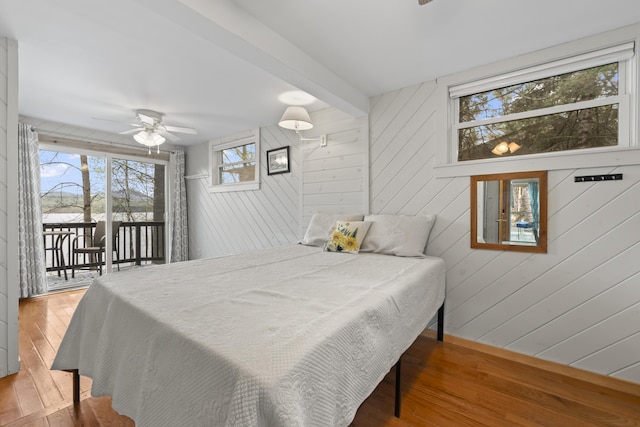 62 Lady Slipper Ln, Weld, ME 04285 - bedroom featuring access to exterior, hardwood / wood-style flooring, and wood walls