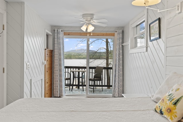 62 Lady Slipper Ln, Weld, ME 04285 - bedroom featuring access to outside, multiple windows, and wooden walls