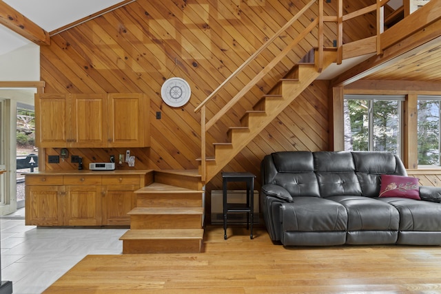 62 Lady Slipper Ln, Weld, ME 04285 - stairs featuring healthy amount of natural light and wood walls