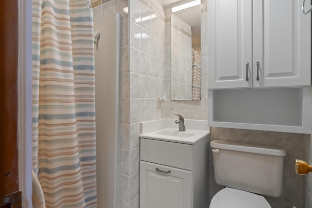 62 Lady Slipper Ln, Weld, ME 04285 - bathroom with tile walls, vanity, toilet, and a shower with curtain
