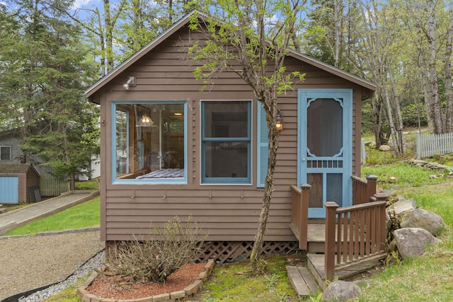 62 Lady Slipper Ln, Weld, ME 04285 - shotgun-style home featuring an outbuilding and a storage shed