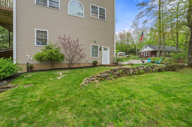 back of property with a yard