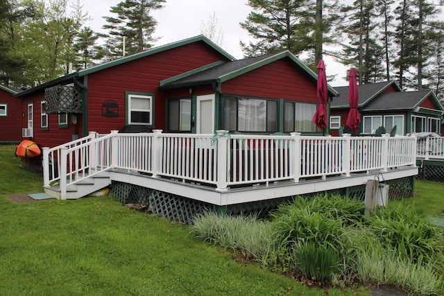 1270 Lakeview Dr Unit 21, China, ME 04358 - back of house with a wooden deck, a yard, and a shingled roof