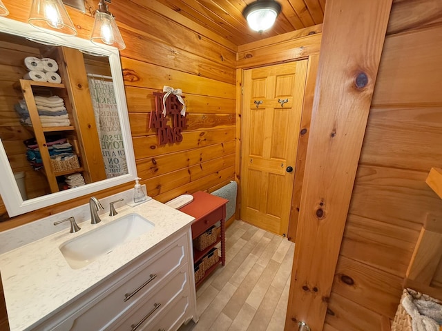 1270 Lakeview Dr Unit 21, China, ME 04358 - full bath featuring vanity, wood finished floors, wood walls, and curtained shower