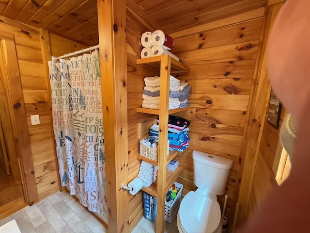 1270 Lakeview Dr Unit 21, China, ME 04358 - bathroom with wooden ceiling, toilet, a shower with shower curtain, and tile patterned floors