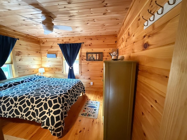 1270 Lakeview Dr Unit 21, China, ME 04358 - bedroom featuring wood ceiling, hardwood / wood-style flooring, and wood walls