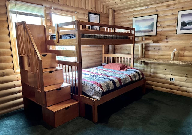 15 Miles Rd, Tremont, ME 04674 - carpeted bedroom with log walls