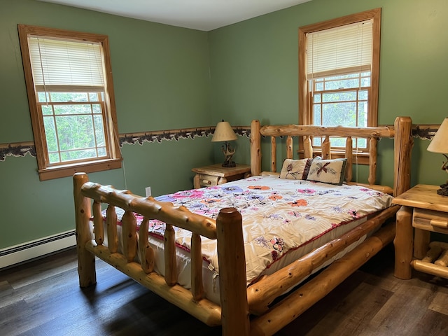 15 Miles Rd, Tremont, ME 04674 - bedroom featuring wood finished floors and a baseboard heating unit
