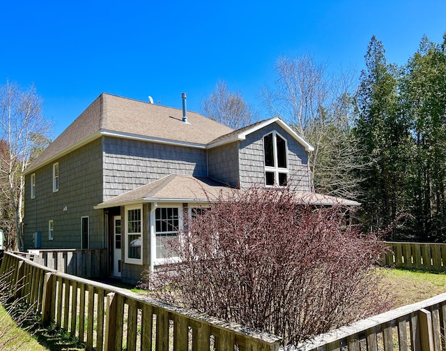 15 Miles Rd, Tremont, ME 04674 - view of side of home featuring a fenced backyard and a shingled roof