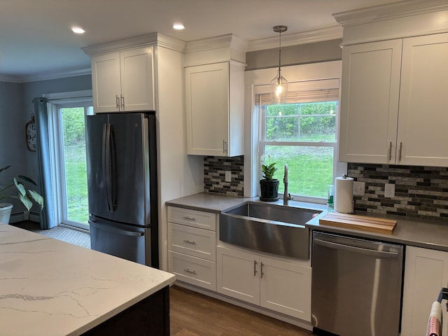 48 Mountain View Dr, Auburn, ME 04210 - kitchen featuring freestanding refrigerator, stainless steel dishwasher, a sink, tasteful backsplash, and white cabinetry