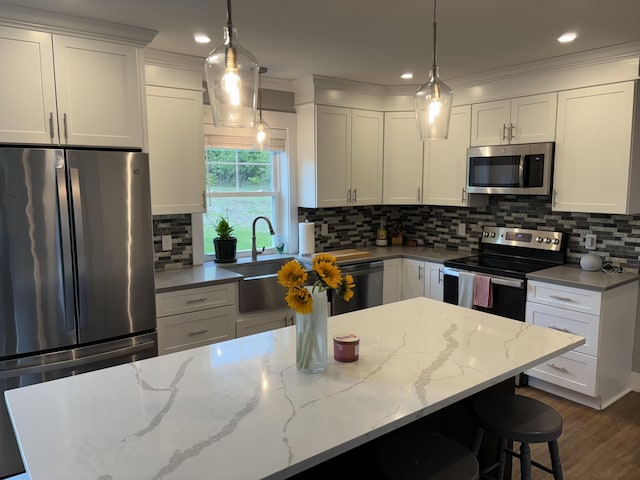 48 Mountain View Dr, Auburn, ME 04210 - kitchen featuring appliances with stainless steel finishes, white cabinets, ornamental molding, and recessed lighting
