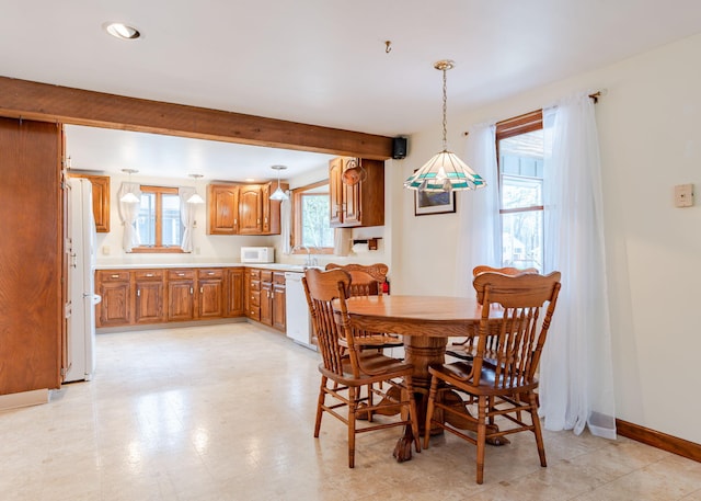 160 Rattlesnake Rd, Brownfield, ME 04010 - dining space with baseboards, beam ceiling, and recessed lighting