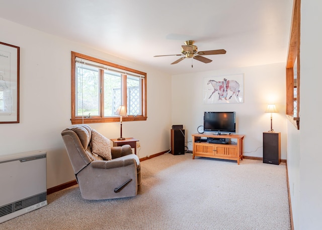 160 Rattlesnake Rd, Brownfield, ME 04010 - living area with light colored carpet, baseboards, a ceiling fan, and heating unit