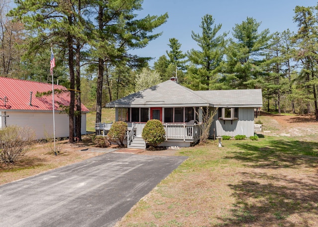 160 Rattlesnake Rd, Brownfield, ME 04010 - view of front of house with covered porch, driveway, and roof with shingles
