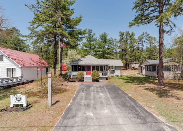 160 Rattlesnake Rd, Brownfield, ME 04010 - bungalow-style home featuring a porch, driveway, and a front yard