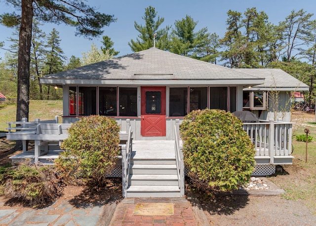 160 Rattlesnake Rd, Brownfield, ME 04010 - view of front of house featuring a sunroom and roof with shingles