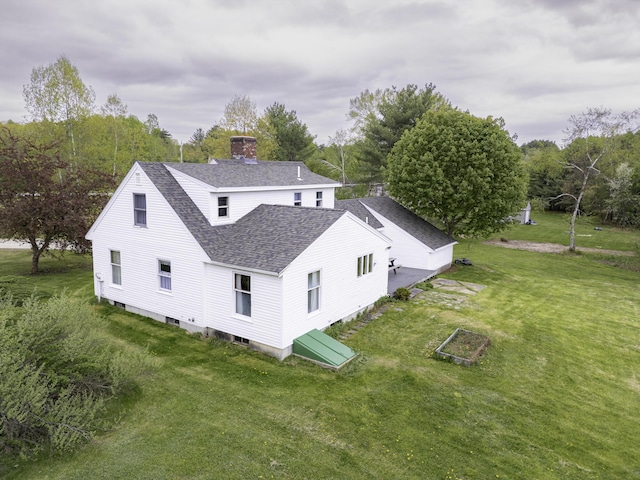 7 Salmon Run, Raymond, ME 04071 - rear view of property with roof with shingles, a lawn, and a chimney