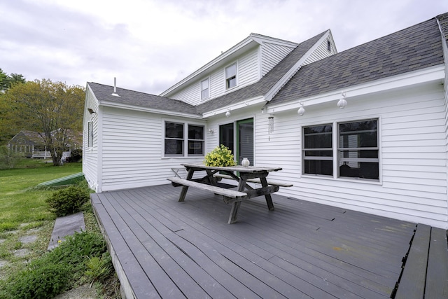 7 Salmon Run, Raymond, ME 04071 - wooden terrace featuring outdoor dining space and a lawn