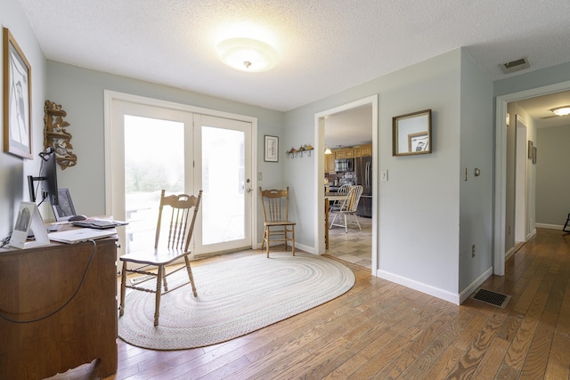 7 Salmon Run, Raymond, ME 04071 - office with hardwood / wood-style floors, a textured ceiling, and baseboards