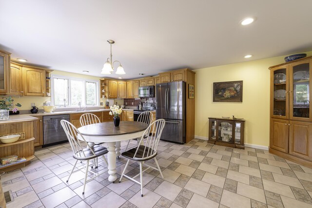 7 Salmon Run, Raymond, ME 04071 - dining area with recessed lighting, baseboards, and a chandelier