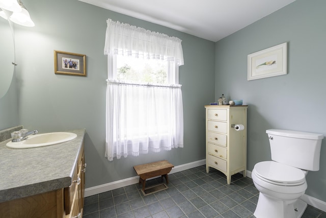 7 Salmon Run, Raymond, ME 04071 - bathroom with tile patterned flooring, toilet, vanity, and baseboards