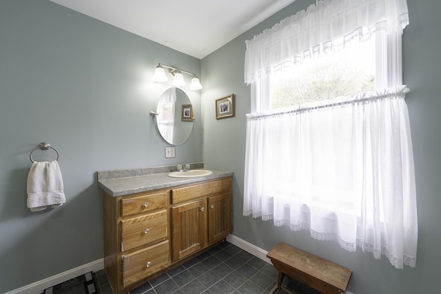 7 Salmon Run, Raymond, ME 04071 - bathroom with vanity, baseboards, and tile patterned floors