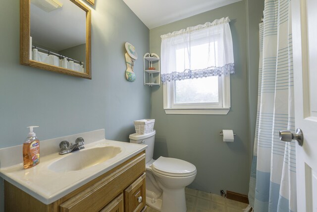 7 Salmon Run, Raymond, ME 04071 - full bath with toilet, vanity, tile patterned floors, and a shower with shower curtain
