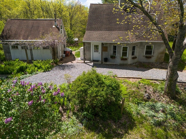 9 Juniper Ln, Damariscotta, ME 04543 - rear view of house with stucco siding and roof with shingles