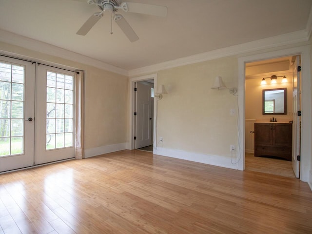 9 Juniper Ln, Damariscotta, ME 04543 - spare room featuring french doors, light wood-style flooring, plenty of natural light, ornamental molding, and a ceiling fan
