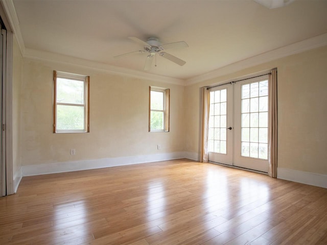 9 Juniper Ln, Damariscotta, ME 04543 - spare room featuring french doors, healthy amount of natural light, ornamental molding, a ceiling fan, and light wood-type flooring