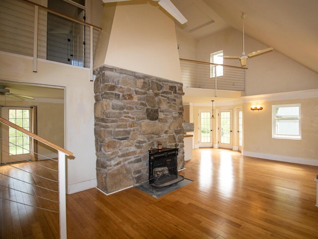 9 Juniper Ln, Damariscotta, ME 04543 - unfurnished living room featuring ceiling fan, high vaulted ceiling, wood finished floors, baseboards, and stairway